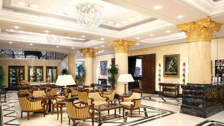 The lobby of Ritz-Carlton Hotel illuminated with chandeliers by Philips Lighting