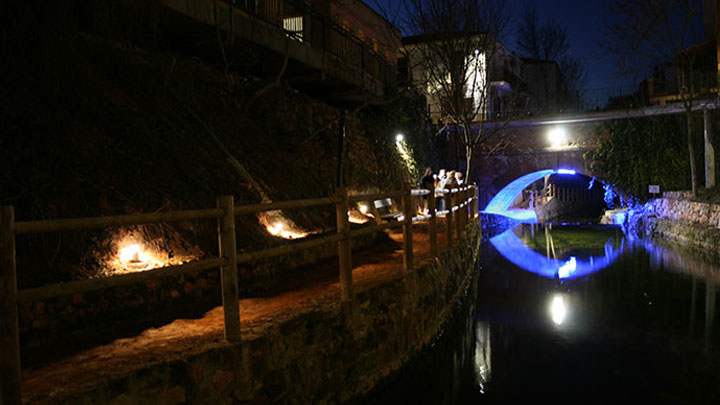 People next to a bridge at the town of Salobre, Spain